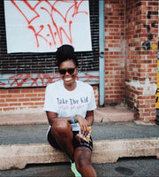 Picture of black woman wearing a wine t-shirt